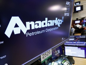 FILE - In this April 12, 2019, file photo the logo for Anadarko Petroleum Corp. appears above a trading post on the floor of the New York Stock Exchange. The overall slowdown in deals during the first quarter could be a prelude to a spike in deals for the rest of 2019. Several large deals have already been announced in the second quarter. Chevron is buying Anadarko Petroleum for $33 billion.