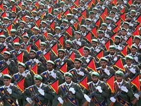 Iran's Revolutionary Guard troops march in a military parade.