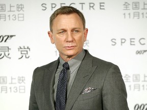 FILE - In this Nov. 10, 2015 file photo, British actor Daniel Craig poses for photographers before a press conference for the James Bond franchise movie "Spectre" in Beijing. The 25th James Bond movie and Craig's last one as 007 is heading home to Jamaica. Craig, Bond producers and director Cary Fukunaga on Thursday,  April 25, 2019, launched the film from the Caribbean island nation where Ian Fleming wrote all of his Bond novels. The still untitled film will be partly set in Jamaica, also a setting in "Dr. No" and "Live and Let Die."