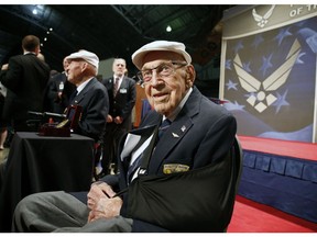 FILE - In this April 18, 2015, file photo, two members of the Doolittle Tokyo Raiders, retired U.S. Air Force Lt. Col. Richard "Dick" Cole, seated front, and retired Staff Sgt. David Thatcher, seated left, pose for photos after the presentation of a Congressional Gold Medal honoring the Doolittle Tokyo Raiders at the National Museum of the U.S. Air Force at Wright-Patterson Air Force Base in Dayton, Ohio. Retired Lt. Col. Richard "Dick" Cole, the last of the 80 Doolittle Tokyo Raiders who carried out the daring U.S. attack on Japan during World War II, has died at a military hospital in Texas. He was 103. A spokesman says Cole died Tuesday, April 9, 2019, at Brooke Army Medical Center in San Antonio, Texas.