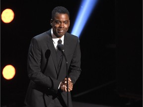FILE - In this March 30, 2019 file photo, Chris Rock presents the award for outstanding comedy series at the 50th annual NAACP Image Awards at the Dolby Theatre in Los Angeles. Netflix is launching its first audio venture that will feature the video streaming service's comedy programming on SiriusXM. The companies on Wednesday, April 10 announced "Netflix Is A Joke Radio" will feature highlights from such comedians as Rock, Dave Chappelle, Ricky Gervais, Sarah Silverman, Jerry Seinfeld and Wanda Sykes. The channel also will feature segments from future stand-up specials and clips from Netflix's comedy talk shows.