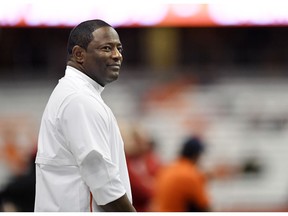 FILE - In this Nov. 9, 2018, file photo, Syracuse head coach Dino Babers watches his players warm up prior to an NCAA college football game against Louisville in Syracuse, N.Y. Syracuse is coming off a breakthrough season that even surprised coach Dino Babers a little bit. Keeping the momentum going is of paramount importance.