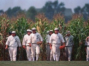 FILE - In this undated file photo, people portraying ghost players emerge from a cornfield as they reenact a scene from the movie "Field of Dreams" at the movie site in Dyersville, Iowa. It's been 30 years since the film was released.