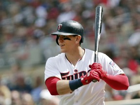 FILE - In this June 10, 2018, file photo, Minnesota Twins' Logan Morrison prepares to bat against the Los Angeles Angels in the fifth inning of a baseball game in Minneapolis. Morrison has agreed to a minor league contract for the New York Yankees, who sought another first base option with Greg Bird again on the injured list. If added to the 40-man roster, Morrison would get a one-year contract with a $1 million salary while in the major leagues.