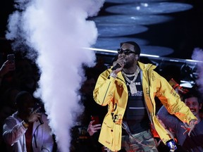 FILE - This Feb. 17, 2019 file photo shows rapper Meek Mill performing before the first half of an NBA All-Star basketball game in Charlotte, N.C.  Cardi B, Meek Mill and Migos will perform at the annual Summer Jam concert, one of the year's top hip-hop shows, on June 2 at MetLife Stadium in East Rutherford, N.J.