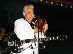 This 2002 photo released by Redbush Classics Records shows rockabilly Hall of Famer Billy Adams performing in Hemsby, England. Adams, who wrote and recorded a rockabilly staple "Rock, Pretty Mama," died Saturday, March 30, 2019, in Westmoreland, Tenn. He was 79. (Redbush Classics Records via AP)
