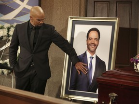 CORRECTS CHARACTER NAME FROM MORGAN TO WINTERS - This image released by CBS shows Shemar Moore portraying Malcolm Winters during a funeral scene for the character Neil Winters, portrayed by the late actor Kristoff St. John, in the daytime series "The Young and the Restless."  St. John, who died at age 52 in February of heart disease, helped cement the prominence of major African-American characters in the traditionally white soap opera world.