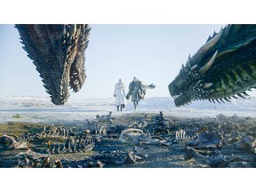 This image released by HBO shows  Emilia Clarke, left, and Kit Harington in a scene from "Game of Thrones," premiering on Sunday, April 14. The first episode of the final season of "Game of Thrones" is a record-breaker for the series and HBO. The pay channel said the 17.4 million viewers who watched Sunday's episode either on TV or online represent a season-opening high for the fantasy saga. (HBO via AP)