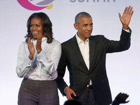 FILE - In this Oct. 31, 2017, file photo, former President Barack Obama, right, and former first lady Michelle Obama appear at the Obama Foundation Summit in Chicago.  The Obamas have unveiled a slate of projects in development for Netflix, a year after the former president and first lady signed a deal with the streaming platform. The Obamas' production company, Higher Ground Productions, announced Tuesday, April 30, 2019, a total of seven films and series that Barack Obama said will entertain but also "educate, connect and inspire us all."