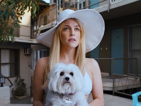 This image released by A24 shows Riley Keough in a scene from "Under the Silver Lake." (A24 via AP)