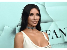 FILE - This Oct. 9, 2018 file photo shows Kim Kardashian West at the Tiffany & Co. 2018 Blue Book Collection: The Four Seasons of Tiffany celebration in New York. The reality star, makeup mogul and criminal justice reformer told Vogue she's apprenticing with a San Francisco law firm, inspired by her effort to free Alice Marie Johnson. She's working with CNN commentator, activist and attorney Van Jones and attorney Jessica Jackson, co-founders of a criminal justice reform group called #cut50, to complete her studies, with the goal of taking the bar in 2022. In California, one doesn't need to attend law school to take the bar exam.