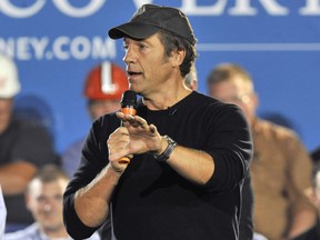FILE - This Sept. 26, 2012 file photo shows TV personality and podcaster Mike Rowe during a campaign stop for Republican presidential candidate Mitt Romney in Bedford Heights, Ohio. Gallery Books, an imprint of Simon & Schuster, announced Thursday, Aril 4, 2019, that Rowe is adapting material from his popular "The Way I Heard It" for a book of the same name.