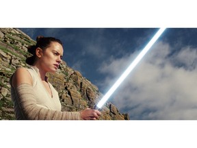 This image released by Lucasfilm shows Daisy Ridley as Rey in "Star Wars: The Last Jedi." The Skywalker saga may be coming to an end this December as the latest Star Wars trilogy finishes, but 8 months out from its release fans still know precious little about what director J.J. Abrams and Lucasfilm president Kathleen Kennedy have in store for "Episode IX," which opens nationwide on Dec. 20.  (Lucasfilm via AP)