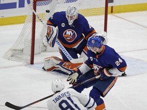 A shot by Toronto Maple Leafs' John Tavares (91) gets past New York Islanders goaltender Robin Lehner (40) for a goal during the third period of an NHL hockey game Monday, April 1, 2019, in Uniondale, N.Y. The Maple Leafs won 2-1.