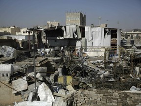 FILE - This April 10, 2019, file photo shows a view of the site of an airstrike by Saudi-led coalition in Sanaa, Yemen. President Donald Trump on Tuesday vetoed a bill passed by Congress to end U.S. military assistance in Saudi Arabia's war in Yemen.