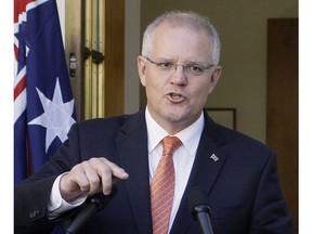 FILE - In this Feb. 13, 2019, file photo, Australian Prime Minister Scott Morrison addresses the media at Parliament House in Canberra, Australia. Morrison was labeled the "Accidental Prime Minister" when he was thrust to the top of a bitterly divided Australian government facing likely defeat in elections only months away. Since he was elected prime minister in a leadership ballot of colleagues in his conservative Liberal Party on Aug. 24, 2018, Morrison has taken as much time as he had available to repair the government and define his leadership before facing the voters.