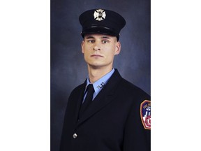 FILE - This undated, file photo provided on April 9, 2019, by the Fire Department of New York shows firefighter Christopher Slutman. The 15-year member of the Fire Department was among three American service members killed by a roadside bomb in Afghanistan on Monday, April 8. (Fire Department of New York via AP, File)