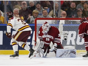 Minnesota-Duluth forward Parker Mackay (39) puts the puck past Massachusetts goalie Filip Lindberg (35) during the first period of the NCAA Frozen Four men's college hockey championship game Saturday, April 13, 2019, in Buffalo, N.Y.