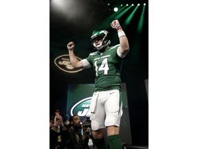 New York Jets quarterback Sam Darnold models the NFL football team's new "Gotham green" uniforms Thursday, April 4, 2019, in New York.
