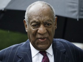 FILE - In this Sept. 25, 2018, file photo, Bill Cosby arrives for his sentencing hearing at the Montgomery County Courthouse in Norristown Pa. A fee dispute between Cosby and a Los Angeles law firm shows the firm billed him about $1 million a month in the run-up to his first sex assault trial. The 81-year-old Cosby is challenging a California arbitration award that trims the $9 million bill from Quinn Emanuel Urquhart and Sullivan to below $7 million.