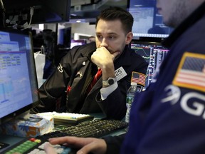 FILE- In this March 5, 2019, file photo specialist Matthew Grenier works on the floor of the New York Stock Exchange. The U.S. stock market opens at 9:30 a.m. EDT on Wednesday, April 3.