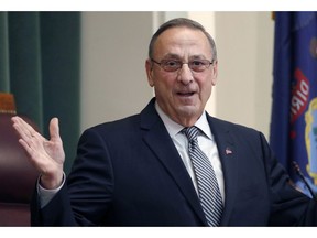 FILE - In this Feb. 13, 2018, file photo, Gov. Paul LePage delivers the State of the State address to the Legislature at the State House in Augusta, Maine. Maine's corrections department says that the former governor pardoned two people in his last days in office without consulting the clemency board and holding a public hearing.