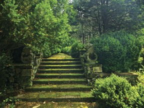 This photo provided by Rizzoli Press shows moss-covered steps guarded by a pair of centuries-old Chinese dragons in Greenwood Gardens, Short Hills, N.J. The photograph is featured in the book "Garden Wild: Wildflower Meadows, Prairie-Style Plantings, Rockeries, Ferneries, and Other Sustainable Designs Inspired by Nature" by Andre Baranowski.