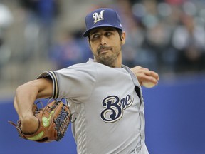 Milwaukee Brewers starting pitcher Gio Gonzalez throws during the first inning of the MLB baseball game against the New York Mets at Citi Field, Sunday, April 28, 2019, in New York.