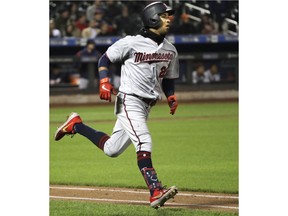 Minnesota Twins Eddie Rosario (20) runs on his second-inning RBI double in an interleague baseball game against the New York Mets, Tuesday, April 9, 2019, in New York.