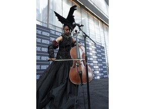 Cellist Kelsey Lu performs at the dedication ceremony for The Shed, a performing arts center at Hudson Yards, Monday, April 1, 2019 in New York. The Shed opens to the public on Friday.