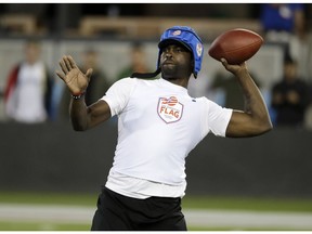 FILE - In this Tuesday, June 27, 2017 file photo, Michael Vick prepares to throw a ball during a flag football exhibition game in San Jose, Calif. On Friday, April 12, 2019, The Associated Press has found that stories circulating on the internet that Nike has chosen to re-hire Vick to represent their brand, are untrue.
