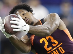 FILE - In this March 2, 2019, file photo, Arizona State wide receiver N'Keal Harry runs a drill during the NFL football scouting combine, in Indianapolis. Harry is a possible pick in the 2019 NFL Draft.
