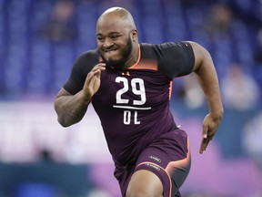 FILE - In this March 1, 2019, file photo, Mississippi State offensive lineman Elgton Jenkins runs a drill at the NFL football scouting combine in Indianapolis. Jenkins is a possible pick in the 2019 NFL Draft.