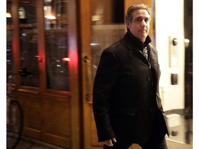 FILE - In this April 10, 2018, file photo, Michael Cohen, President Donald Trump's personal attorney, walks to his hotel in New York. A year ago Tuesday, April 9, 2019, FBI agents raided Cohen's home and office and some pundits declared it the beginning of the end of Donald Trump's presidency. And yet, there are mounting indications that Cohen's usefulness to federal prosecutors is drying up.