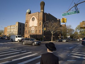 FILE- In this April 26, 2018 file photo, a Jewish boy walks to a yeshiva in the Brooklyn borough of New York. On Thursday, April 18, 2019, a judge has struck down New York State Education Department guidelines for ensuring that private schools including religious schools provide instruction that's substantially equivalent to what public schools provide. The ruling by a state supreme court judge in Albany, N.Y., nullifies guidelines intended to ensure that ultra-Orthodox yeshivas teach secular subjects like English and math.