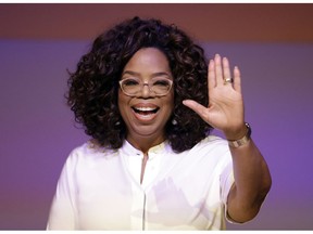 FILE- In the Nov. 29, 2018 file photo, Oprah Winfrey waves the audience during a tribute to Nelson Mandela and promoting gender equality event at University of Johannesburg in Soweto, South Africa. On Wednesday, April, 10, 2019, Winfrey gave the keynote speech at 10th annual Women in the World Summit at New York City's Lincoln Center.