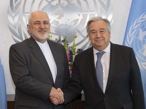 In this photo provided by the United Nations, U.N. Secretary General Antonio Guterres, right, greets Mohammad Javad Zarif, Minister for Foreign Affairs, Islamic Republic of Iran, Wednesday, April 24, 2019 at United Nations headquarters.