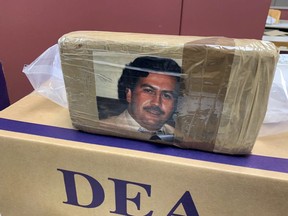 In this undated photo provided by the New York City office of the Drug Enforcement Administration, a confiscated package of drugs is labeled with a picture of Pablo Escobar. Drug enforcement officials in New York say they've seized narcotics labeled with a photo of legendary Colombian narco Pablo Escobar. (DEA's New York City office via AP)