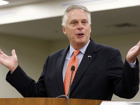 FILE - In this Monday, Aug. 21, 2017, file photo, then-Virginia Gov. Terry McAuliffe delivers his annual budget projection at the Capitol in Richmond, Va. Former Virginia Gov. McAuliffe won't run for president in 2020, according to two people familiar with calls he made Wednesday, April 17, 2019, to allies.