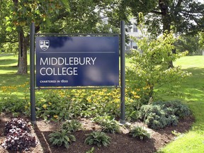 FILE - This Aug. 31, 2017, file photo, shows a sign for Middlebury College on the campus in Middlebury, Vt. A Middlebury College chemistry professor whose written exam question asked students to calculate the lethal dose of a poisonous gas used in Nazi gas chambers during the Holocaust has taken a leave of absence, the school said.