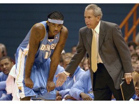 FILE - In this Sunday, Oct. 19, 2003, file photo, Denver Nuggets' Carmelo Anthony, left, receives instructions from assistant coach John MacLeod in the second period of a preseason game against the Detroit Pistons in Syracuse, N.Y. MacLeod, the longtime NBA coach who led the Phoenix Suns to the 1976 NBA Finals, has died. He was 81. MacLeod's son Matt confirmed his father's death Sunday, April 14, 2019, to The Associated Press.