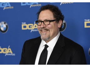 File-This photo taken Feb. 3, 2018, shows Jon Favreau arrives at the 70th annual Directors Guild of America Awards at The Beverly Hilton hotel in Beverly Hills, Calif.  Favreau teased "The Mandalorian" at the Star Wars Celebration in Chicago on Sunday, April 14, 2019, giving fans their first look at the most anticipated series yet from the galaxy far, far away. Favreau's eight-episode series is to debut on the Disney-Plus streaming service on November 12.