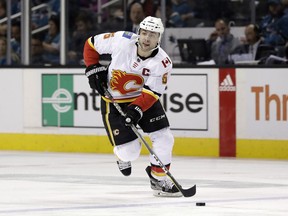 File-This March 24, 2019, file photo shows Calgary Flames' Mark Giordano (5) during the first period of an NHL hockey game against the San Jose Sharks in San Jose, Calif.  Giordano has had a career-best season for a captain on the Pacific Division's top team.