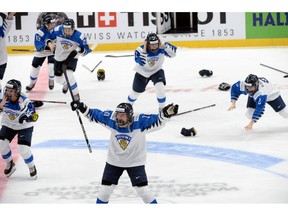 Finnish players celebrate a game-winning overtime goal which was later disallowed during the IIHF Women's Ice Hockey World Championships final match between the United States and Finland in Espoo, Finland, on Sunday, April 14, 2019.