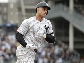 New York Yankees' Aaron Judge runs the bases after hitting a solo home run off Kansas City Royals relief pitcher Heath Fillmyer during the first inning of a baseball game, Saturday, April 20, 2019, in New York.