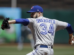 Toronto Blue Jays pitcher Matt Shoemaker works against the Oakland Athletics in the first inning of a baseball game Saturday, April 20, 2019, in Oakland, Calif.