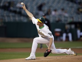 Oakland Athletics pitcher Chris Bassitt works against the Texas Rangers in the first inning of a baseball game Monday, April 22, 2019, in Oakland, Calif.