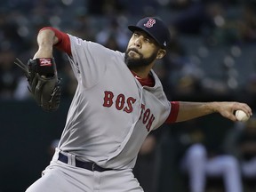 Boston Red Sox pitcher David Price throws against the Oakland Athletics during the first inning of a baseball game in Oakland, Calif., Monday, April 1, 2019.