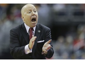 FILE - In this March 22, 2019, file photo, Cincinnati head coach Mick Cronin encourages his team in the second half against Iowa in a first-round game in the NCAA men's college basketball tournament, in Columbus, Ohio. Cronin has been hired as UCLA's basketball coach, ending a months-long search to find a replacement for the fired Steve Alford. The university says Cronin agreed to a $24 million, six-year deal on Tuesday, April 9, 2019.