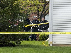 Police work the scene where multiple people were found dead Sunday night, at the Lakefront at West Chester apartment complex in West Chester Township, Ohio, Monday April 29, 2019.